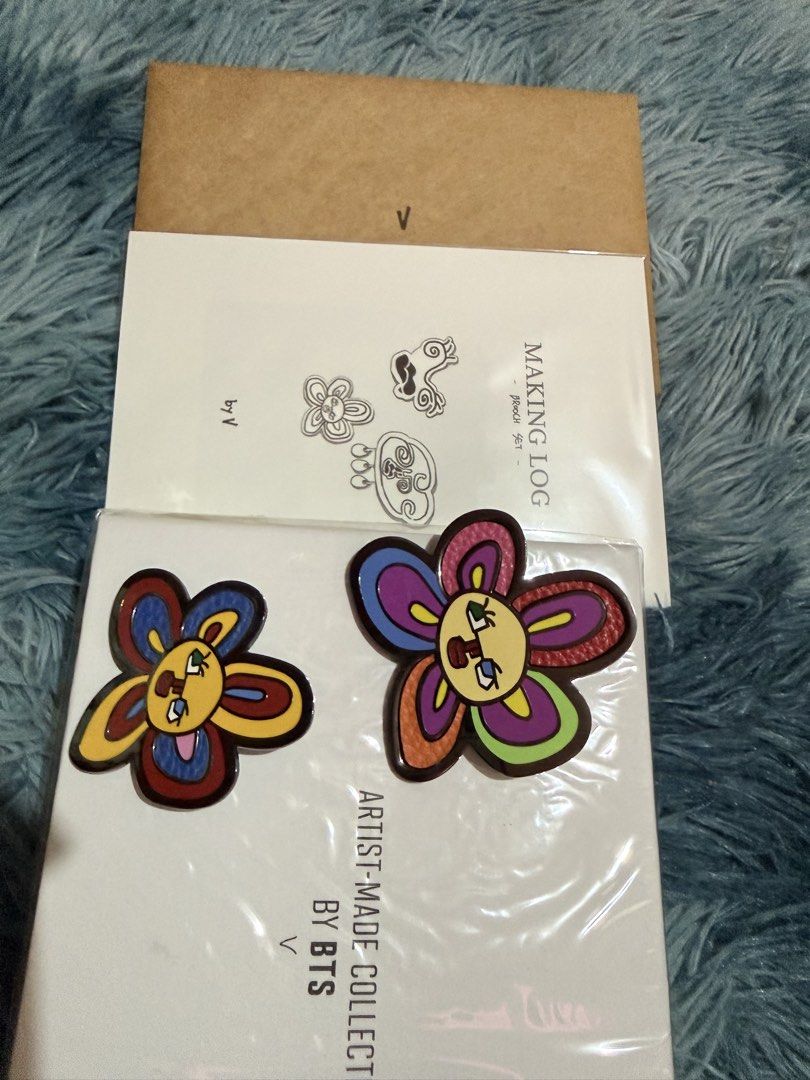 BTS Artist Made Collection V Brooch set (Category: Brooches) located in Manila. Submitted by assortedmixies (Listing ID 1456982807, Image 2). Description: - Authentic BTS Artist Made Collection brooch set by V. - Features V's unique and colorful flower design. originally 3 brooches, but im keeping the smallest one. - Perfect for accessorizing bags, clothes, and more. - Comes with a special photo card. - Meetup available at Robinsons Magnolia, Que