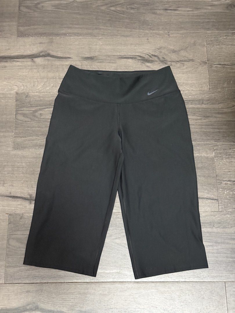BUNDLE: Nike Dri-FIT T-shirts and Capris Set (Category: Activewear) located in Quezon City. Submitted by rhodesmuse (Listing ID 1457117706, Image 3). Description: - Set includes: 1 navy blue Nike Dri-FIT t-shirt, 1 white Nike Dri-FIT t-shirt - Also includes: 1 pair of black capri pants - Pants are made from recycled materials - Ideal for workouts, gym sessions, or everyday casual wear.