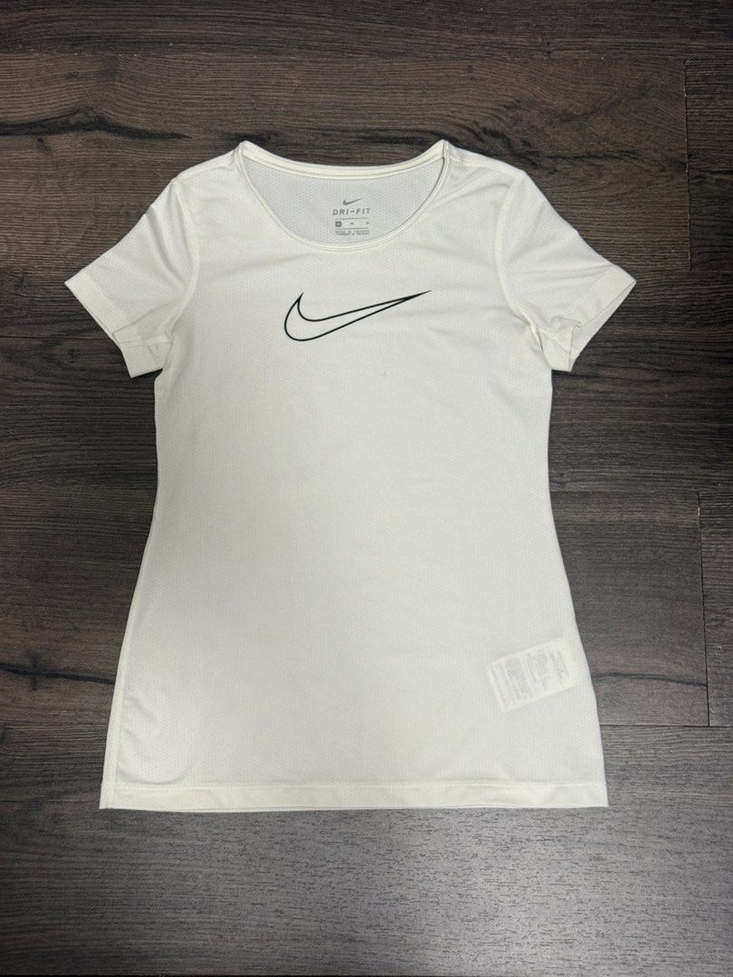 BUNDLE: Nike Dri-FIT T-shirts and Capris Set (Category: Activewear) located in Quezon City. Submitted by rhodesmuse (Listing ID 1457117706, Image 2). Description: - Set includes: 1 navy blue Nike Dri-FIT t-shirt, 1 white Nike Dri-FIT t-shirt - Also includes: 1 pair of black capri pants - Pants are made from recycled materials - Ideal for workouts, gym sessions, or everyday casual wear.