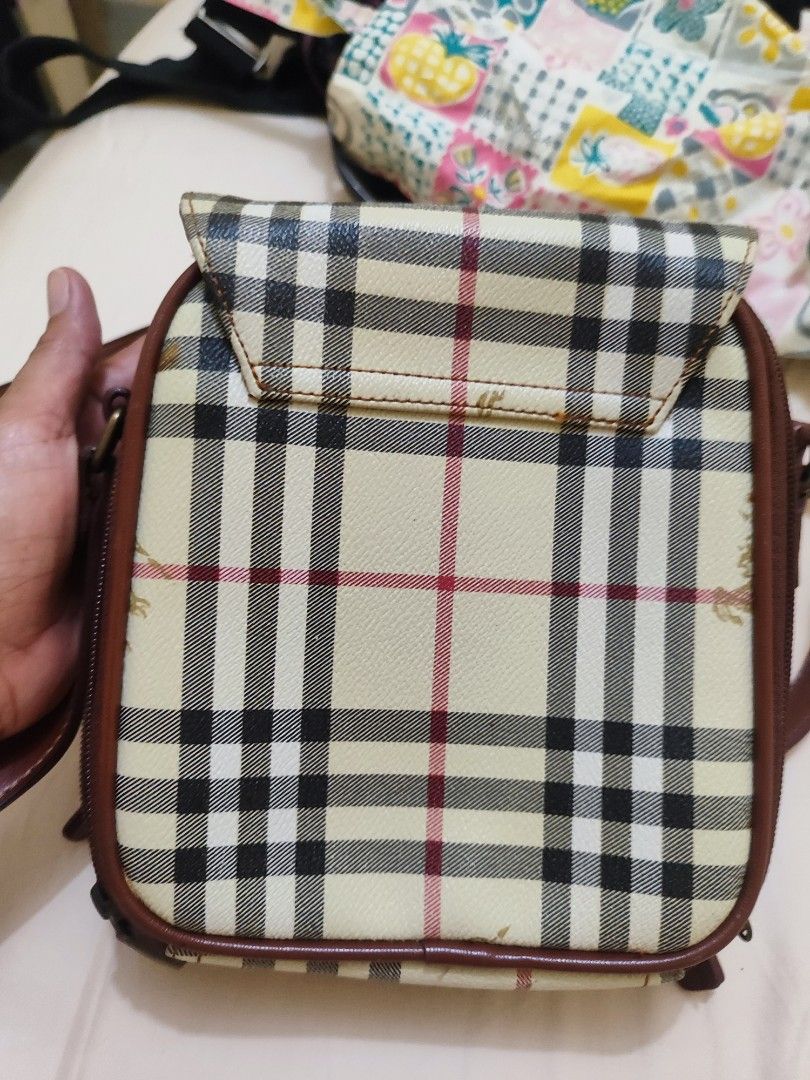 Burberry Nova Check Crossbody Bag (Category: Luxury Bags & Wallets) located in Paniqui. Submitted by arlenepari29210 (Listing ID 1457116879, Image 3). Description: - Classic Burberry crossbody bag - Iconic Nova Check pattern - Genuine leather trim and strap - Secure buckle closure on flap - Internal zipped compartments for storage - Perfect for everyday use - Shows some signs of wear, but plenty of life left - Authenticity not guarantee, ukay sou