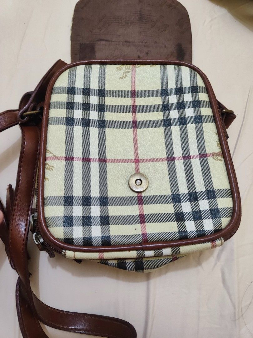 Burberry Nova Check Crossbody Bag (Category: Luxury Bags & Wallets) located in Paniqui. Submitted by arlenepari29210 (Listing ID 1457116879, Image 2). Description: - Classic Burberry crossbody bag - Iconic Nova Check pattern - Genuine leather trim and strap - Secure buckle closure on flap - Internal zipped compartments for storage - Perfect for everyday use - Shows some signs of wear, but plenty of life left - Authenticity not guarantee, ukay sou