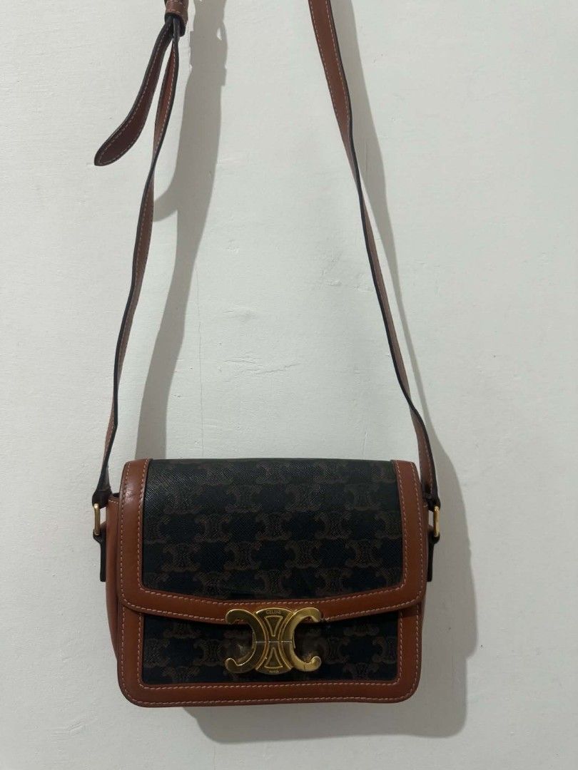 Celine Triomphe Canvas & Leather Crossbody Bag (Category: Luxury Bags & Wallets) located in Bacolod City. Submitted by asheroth77 (Listing ID 1457071707, Image 1). Description: Celine Triomphe crossbody bag - Classic canvas with brown leather trim - Elegant gold hardware closure - Multiple interior compartments for organization - Adjustable strap for comfortable wear - Ideal for everyday use.