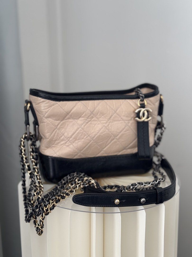 Chanel Small Gabrielle Hobo Bag (Category: Luxury Bags & Wallets) located in Las Pinas. Submitted by shopdeynuh (Listing ID 1457000190, Image 1). Description: Classic Black/Beige color combo In good condition, structure still intact with normal signs of use (some creasing, base scratches, leather rubs on strap) Comes with dustbag, authenticity card, copy receipt, bag organizer and entrupy certificate of authenticity.