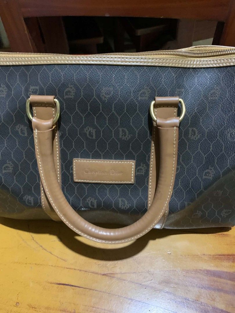Christian Dior Monogram Boston Bag (Category: Luxury Bags & Wallets) located in Gapan. Submitted by cleverstar.36492b (Listing ID 1457059180, Image 2). Description: Vintage Christian Dior boston bag. Classic monogram print all over. Tan leather trim and handles. Gold hardware details. Zipper closure. Made in France. Great for travel or everyday use..
