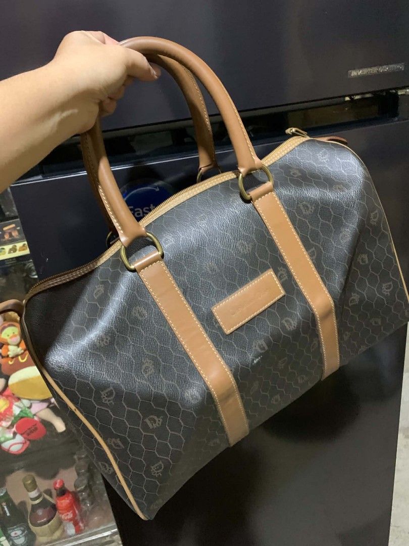 Christian Dior Monogram Boston Bag (Category: Luxury Bags & Wallets) located in Gapan. Submitted by cleverstar.36492b (Listing ID 1457059180, Image 1). Description: Vintage Christian Dior boston bag. Classic monogram print all over. Tan leather trim and handles. Gold hardware details. Zipper closure. Made in France. Great for travel or everyday use..