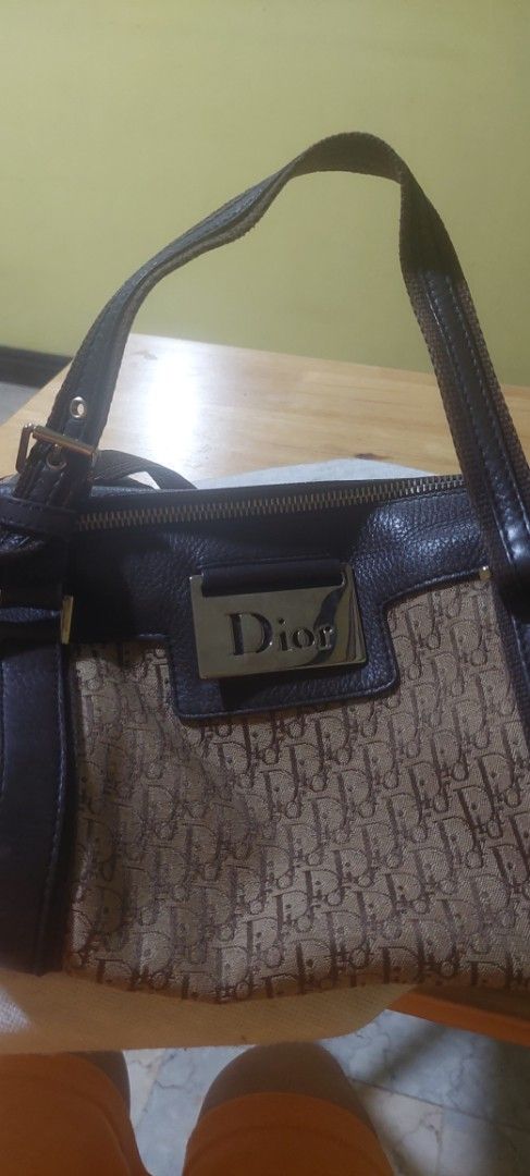 Christian Dior Monogram Canvas Leather Trim Shoulder Bag (Category: Luxury Bags & Wallets) located in Manila. Submitted by aabila (Listing ID 1457033090, Image 2). Description: - Authentic Christian Dior shoulder bag - Iconic Dior monogram canvas with brown leather trim - Interior zip pocket - Includes dust bag and authenticity cards - Ideal for everyday use.