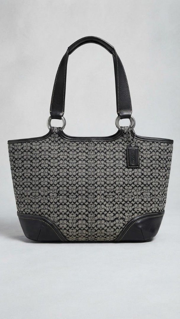 Coach Monogram Canvas Leather Trim Tote Bag (Category: Luxury Bags & Wallets) located in Davao. Submitted by _jetnest25 (Listing ID 1457070264, Image 2). Description: - Classic Coach tote bag - Signature monogram canvas with black leather trim - Front buckle detail - Secure zipper closure for main compartment - Interior leather Coach creed patch - Ideal everyday bag.