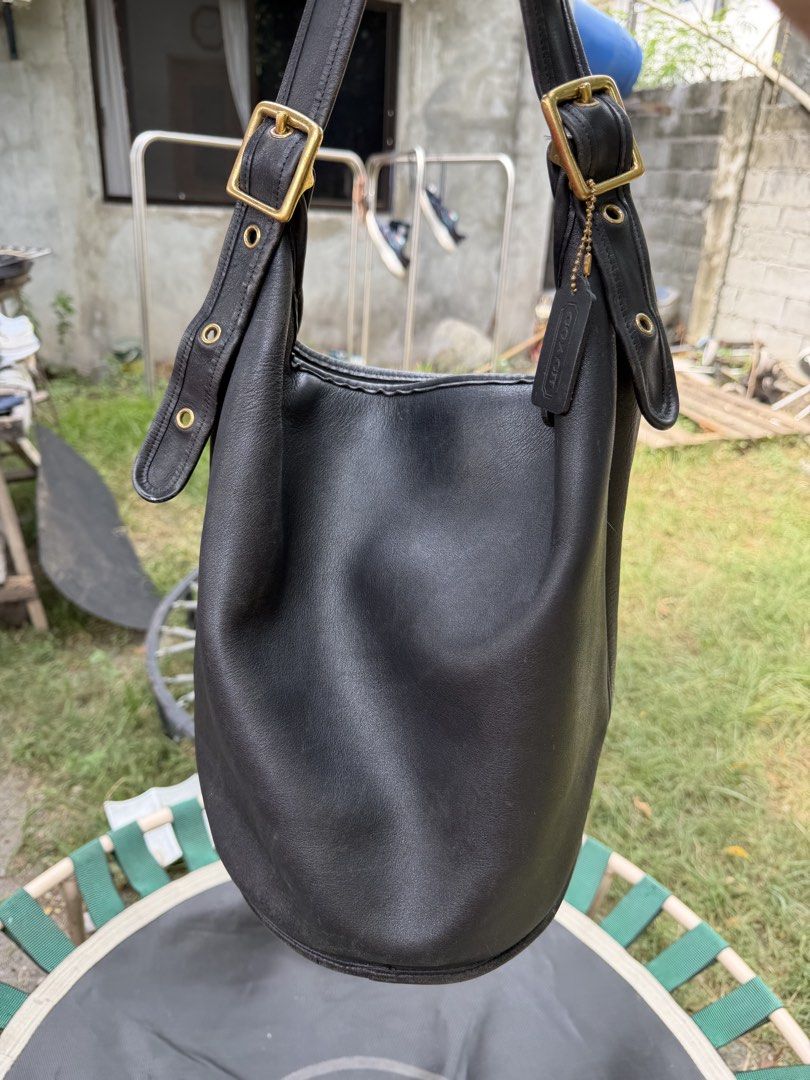 COACH VINTAGE DUFFLE BAG BLACK 9085 (Category: Luxury Bags & Wallets) located in General Santos City (Dadiangas). Submitted by prelovedpickers (Listing ID 1457005020, Image 1). Description: Coach Vintage Duffle Bag XL size color black soft leather Made United States in glove- tanned cowhide Approx. bag size: 15" x 13" x 9" Adjustable leather strap, drop: 16" to 22" Top zipper closure Deep interior with a slip pocket with embossed Coach Creed Orig
