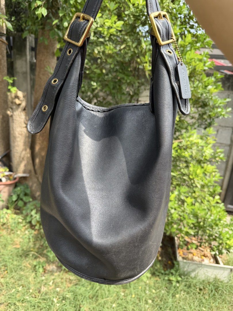 COACH VINTAGE DUFFLE BAG BLACK 9085 (Category: Luxury Bags & Wallets) located in General Santos City (Dadiangas). Submitted by prelovedpickers (Listing ID 1457005020, Image 2). Description: Coach Vintage Duffle Bag XL size color black soft leather Made United States in glove- tanned cowhide Approx. bag size: 15" x 13" x 9" Adjustable leather strap, drop: 16" to 22" Top zipper closure Deep interior with a slip pocket with embossed Coach Creed Orig