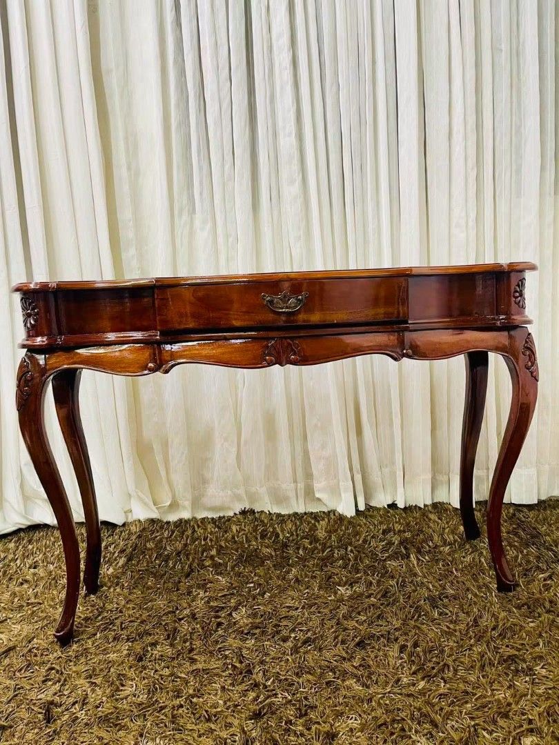 Console Table (Category: Tables & Sets) located in Meycauayan. Submitted by marygracecasimiro (Listing ID 1457020200, Image 2). Description: From Indonesia Solid Wood A classic Baroque-style or Louis XV-inspired wooden console table featuring a polished dark wood finish, graceful cabriole legs, and a central storage drawer with ornate hardware. Dimension: L44x15xH31 inches Get this for only 11k💚.
