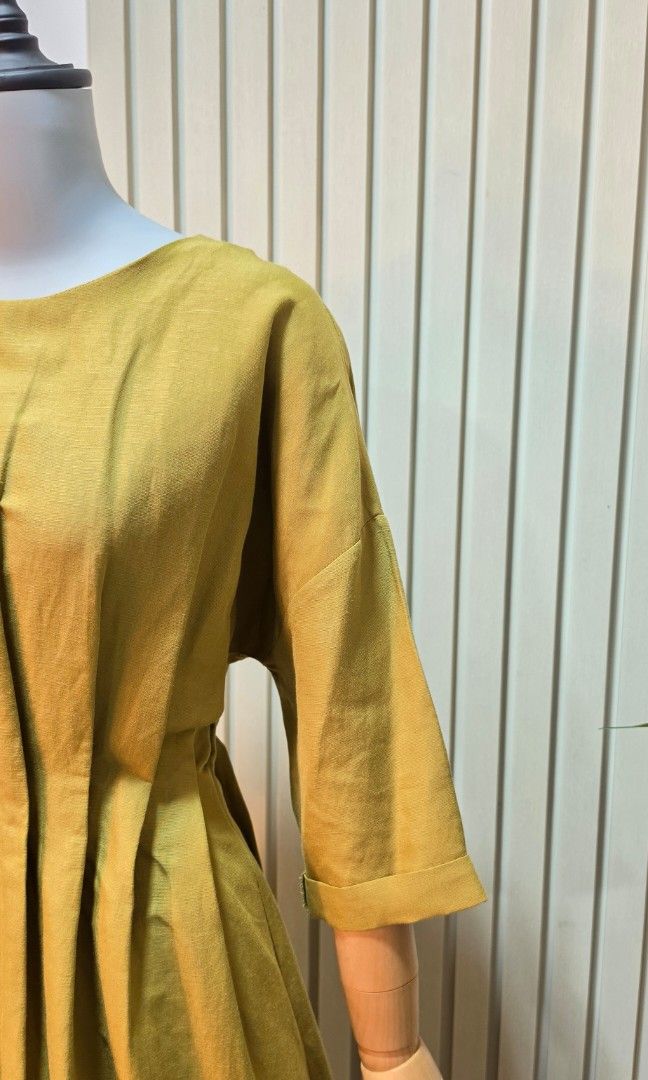 COS (Category: Dresses) located in Manila. Submitted by upcycleduneven (Listing ID 1457100973, Image 3). Description: COS olive-yellow midi dress features a relaxed crew neckline, three-quarter sleeves, and a subtle cinched waist with pleated skirt detailing PAY WITHIN 24 HOURS JRS EXPRESS REGULAR SHIPPING GRAB/LALAMOVE SAME DAY DELIVERY.