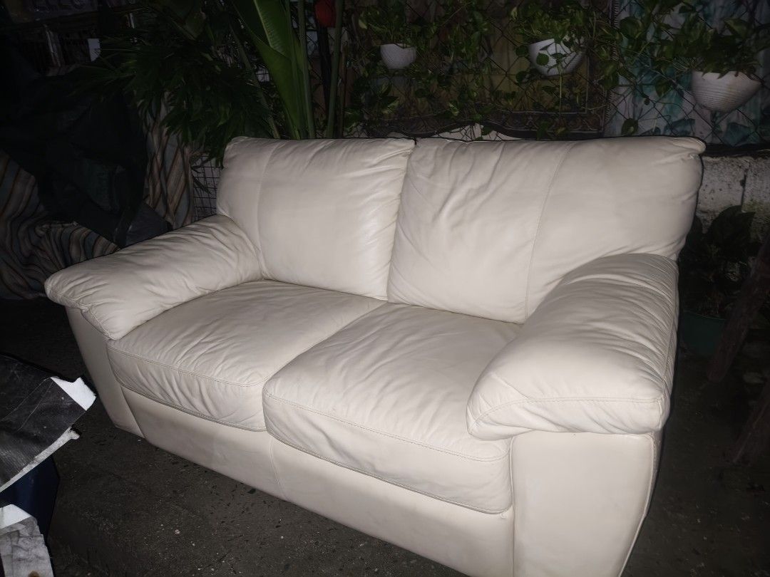 Cream Leather 2-Seater Sofa IKEA (Category: Sofas) located in Makati City. Submitted by candyhinojales (Listing ID 1457012614, Image 3). Description: - Cream leather sofa - Comfortable seating for two - Dimensions: 65" W x 36" D x 32" H - Ideal for living rooms or apartments.