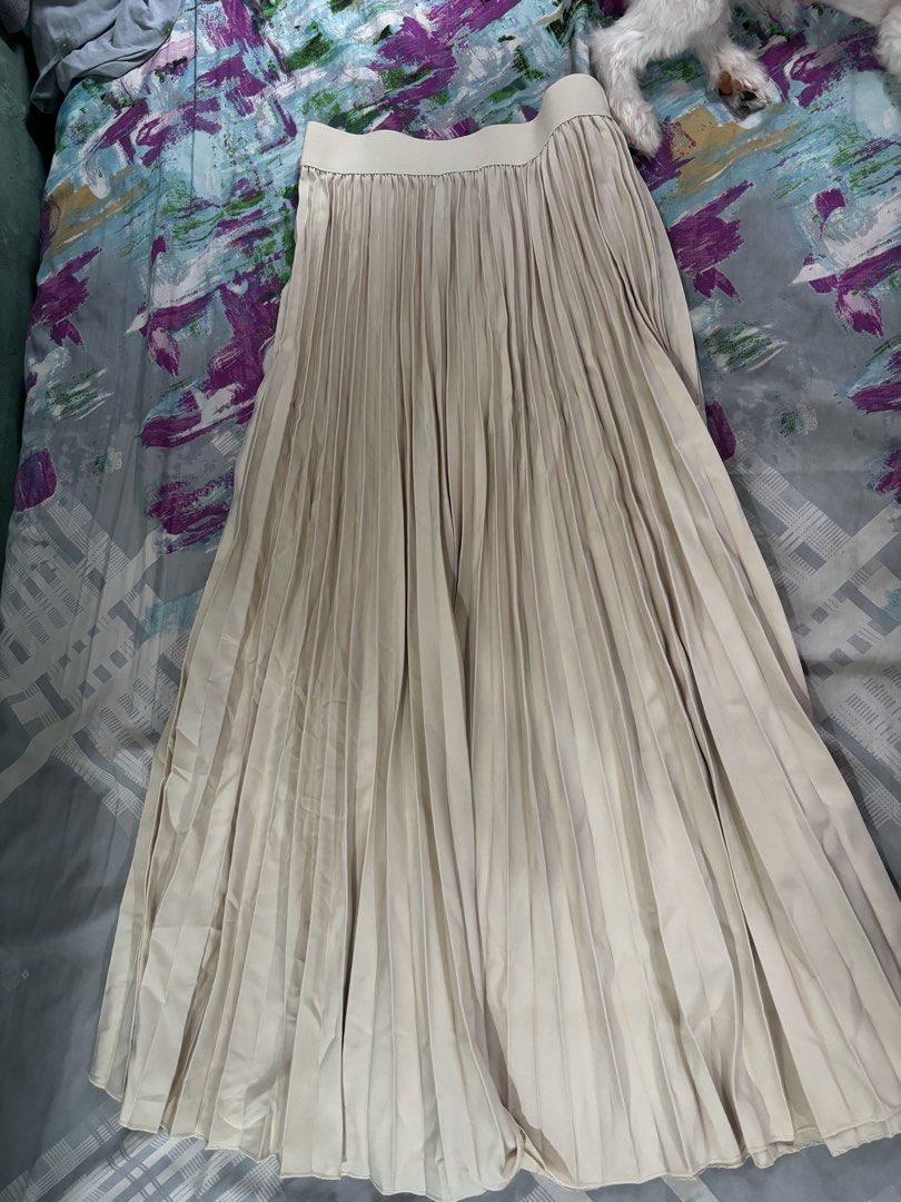 Cream Pleated Midi Skirt (Category: Skirts) located in Marikina City. Submitted by minsh113 (Listing ID 1457022561, Image 2). Description: - Cream colored pleated midi skirt - Comfortable elastic waistband - Flowy and lightweight material - Perfect for dressing up or down - Easy to pair with any top - Suitable for casual and formal events.