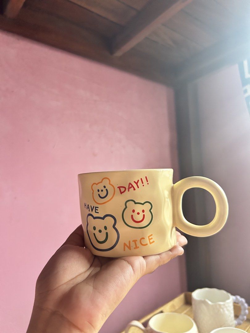 Cute Ceramic Mugs with Fun Designs and Unique Handles (Category: Coffee & Tea Tableware) located in Manila. Submitted by mayah99 (Listing ID 1457072805, Image 3). Description: Prices✨ Mug 1 - 220 2 - 220 3 - 220 4 - 220 5 - 220 6 - 120 7 - 220 8 - 200 9 - 120 10 - 200 - Set of cute ceramic mugs - Unique designs: floral patterns & fun bear faces - Positive messages like 'HAVE A NICE DAY!!' - Distinct handles: chunky and rounded options - Ideal for