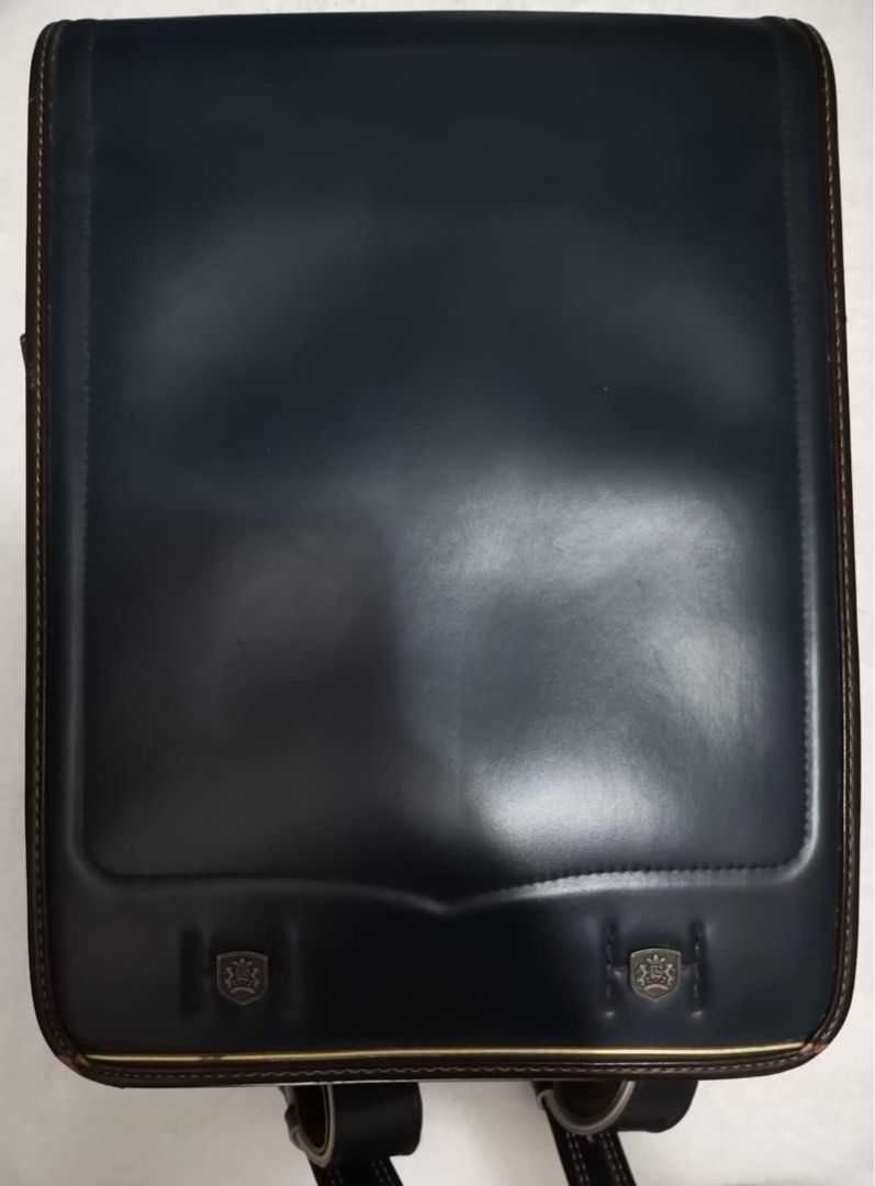Dark Blue Leather Randoseru Japanese School Backpack (Category: Babies & Kids Fashion) located in Quezon City. Submitted by heybailey (Listing ID 1457032996, Image 1). Description: - Classic Japanese school backpack style - Durable dark blue leather with brown trim - Secure metal clasp closure - Adjustable leather straps - Convenient side zippered pocket - Suitable for school or everyday use.