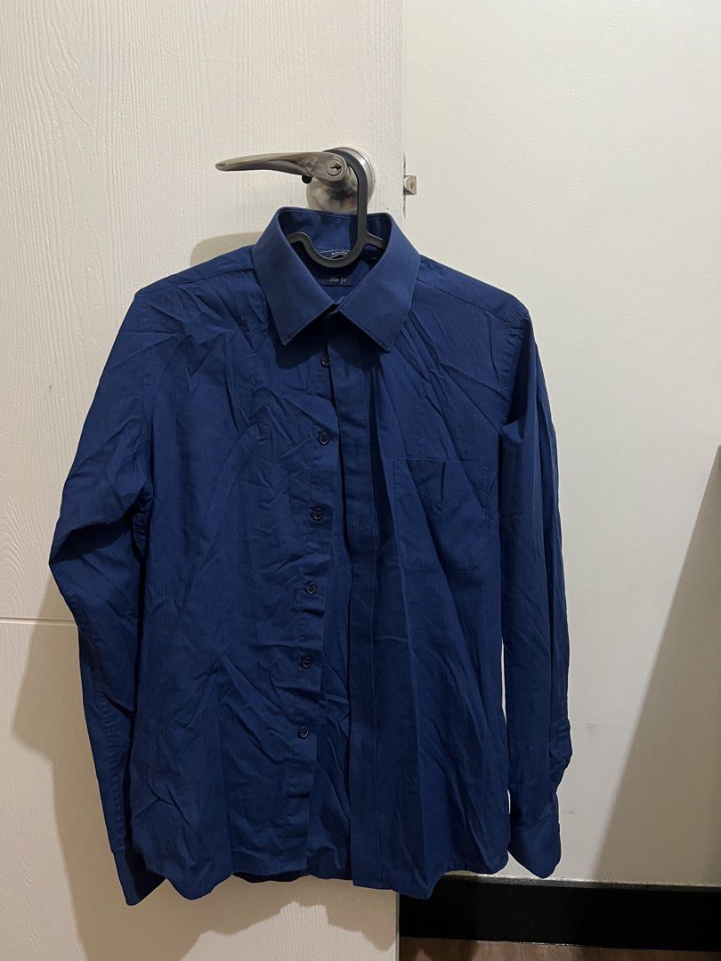Dark Blue Striped Long Sleeve Button-Up XS (Category: Tshirts & Polo Shirts ) located in Las Pinas. Submitted by karlfcon (Listing ID 1457115112, Image 1). Description: - Dark blue button-up shirt - Subtle vertical stripe pattern - Long sleeves with button cuffs - Classic collar - Standard fit - Versatile for work or casual wear - Pairs well with trousers or jeans - XS Slim Fit - No stains or cuts.