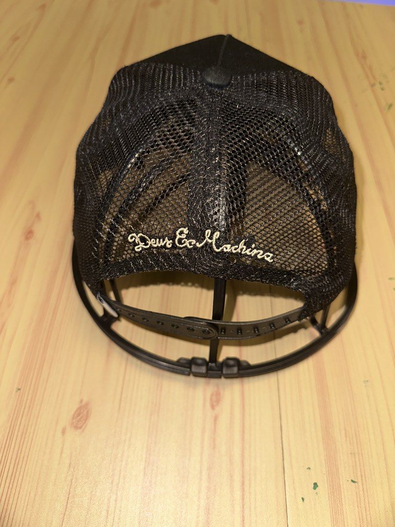 Deus Ex Machina Black Mesh Sparks Trucker Cap (Category: Caps & Hats) located in Quezon City. Submitted by mancave_stuff (Listing ID 1456966404, Image 3). Description: - Brand: Deus Ex Machina - Style: Trucker Cap - Features: Mesh back for breathability - Logo: Classic Deus oval logo on front - Embroidery: 'Deus Ex Machina' on back - Closure: Adjustable snapback - Ideal for: Casual wear -Used once only.