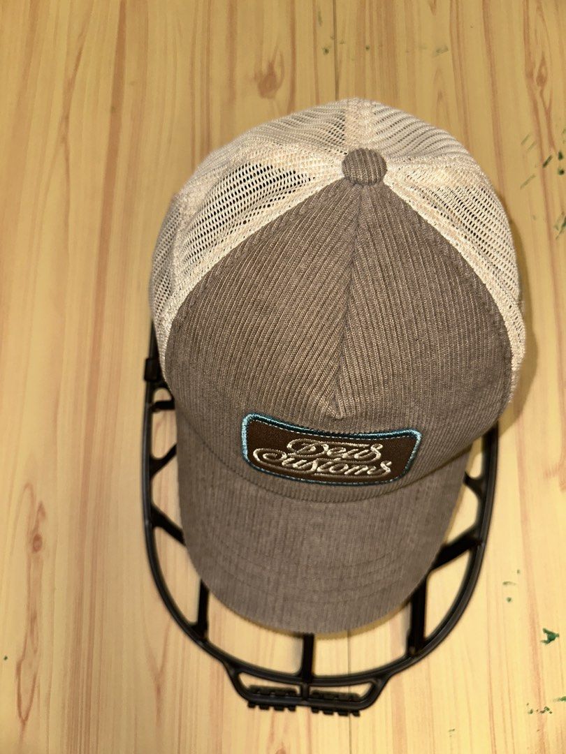 Deus Ex Machina Corduroy Trucker Cap (Category: Caps & Hats) located in Quezon City. Submitted by mancave_stuff (Listing ID 1456967342, Image 1). Description: - Brand: Deus Ex Machina - Style: Trucker Cap - Material: Brown Corduroy with Mesh Back - Features: Deus logo patch on front, embroidered text on back - Fit: Adjustable strap - Occasion: Casual wear .
