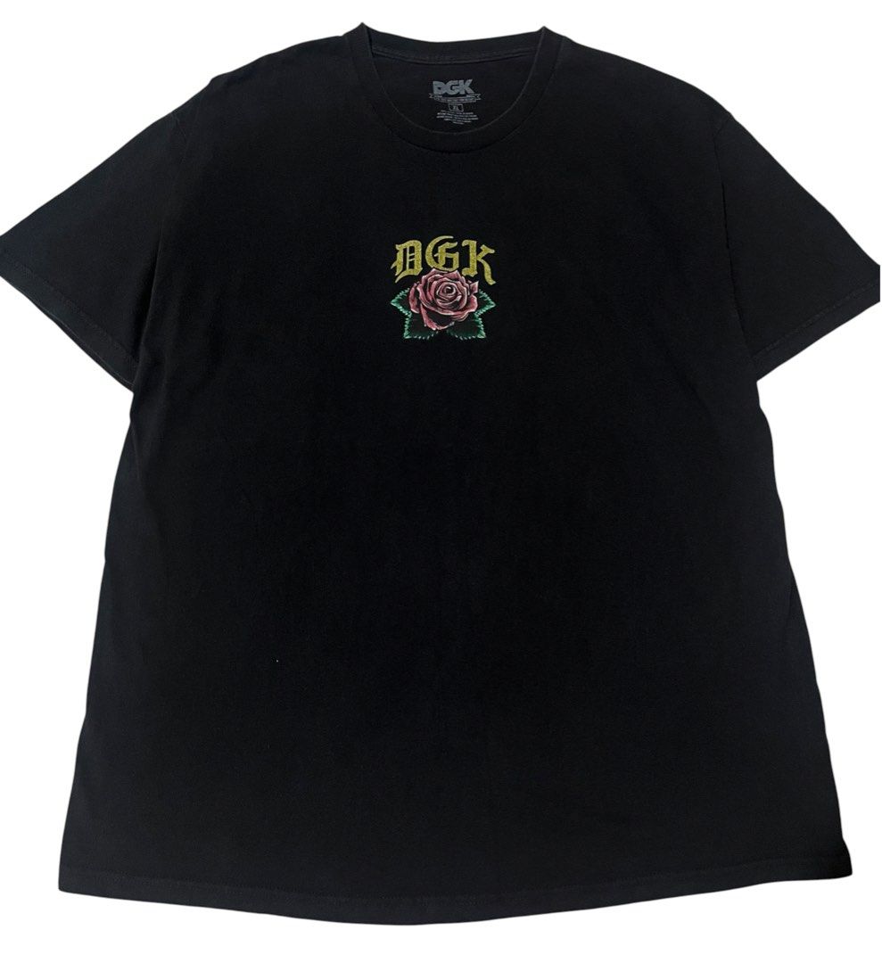 DGK "Guadalupe" T-Shirt (Category: Tshirts & Polo Shirts ) located in Manila. Submitted by rhaldstsh.ph (Listing ID 1457110177, Image 1). Description: This black graphic tee is one of DGK’s most iconic and culturally significant designs, representing themes of perseverance and hustle. Front Graphic: Features a subtle chest logo showcasing a beautifully illustrated pink rose centered beneath a gold gothic-style DGK spell-out. Back Graphic: A massi