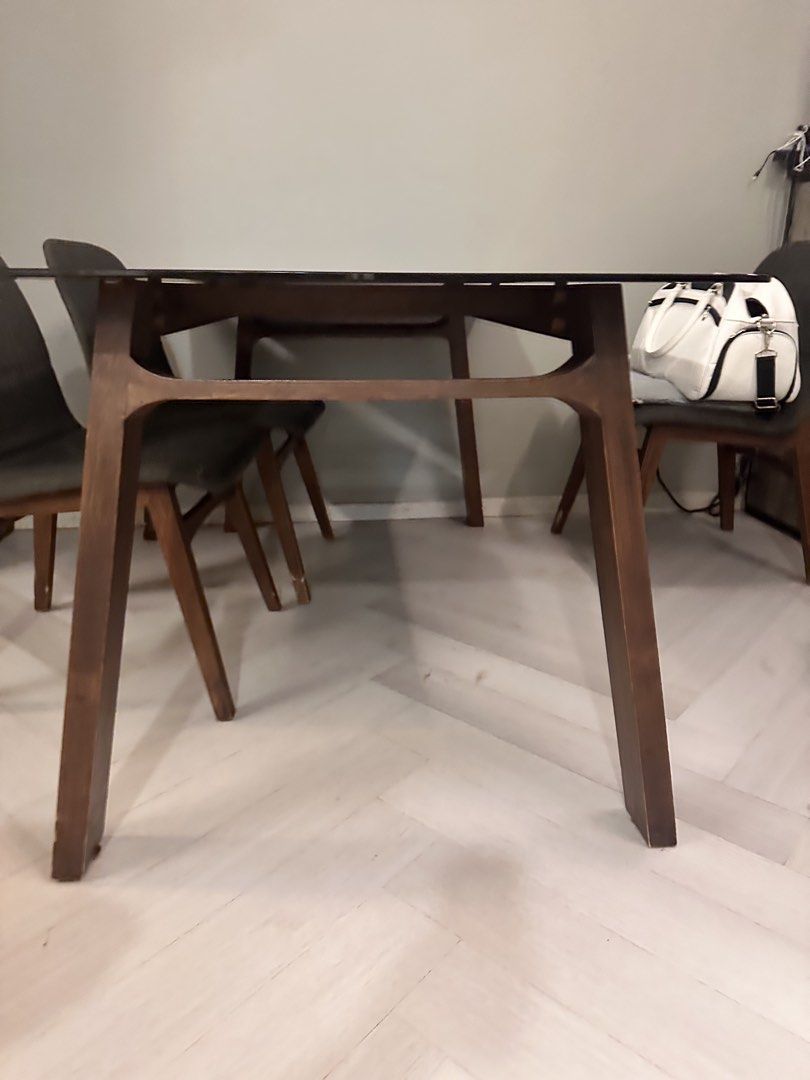 Dining Table (Category: Tables & Sets) located in Singapore. Submitted by maxxev (Listing ID 1457091730, Image 2). Description: 1.6m length and 0.9m width. Glass dining table, no crack on glass and very stable. Only some cosmetic damage on the leg which is wooden. For free, self pick up with your own transport. Only can collect on 14th Sept 2026 due to selling of house. Does not come with chair. First come first serve. Is free!!.