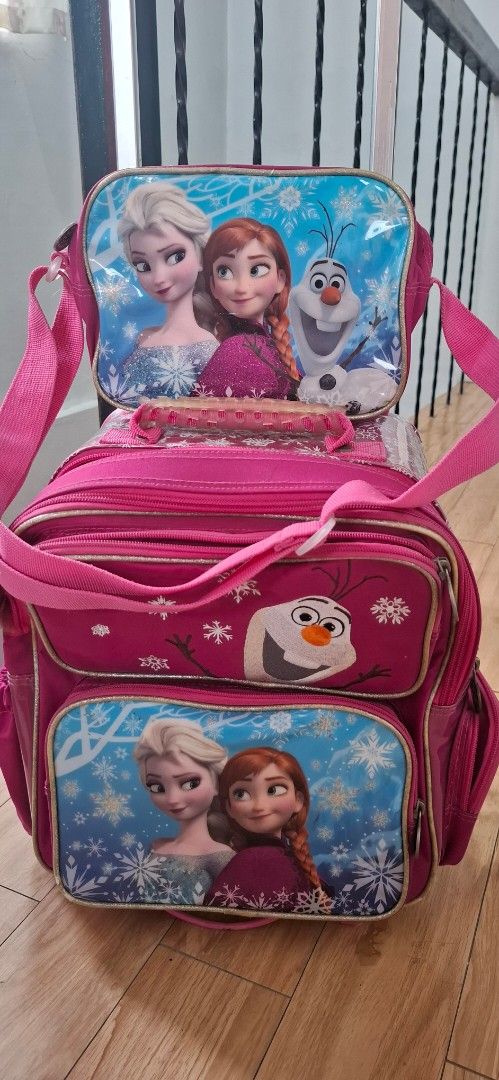 Disney Frozen Trolley school bag (Category: Backpacks) located in Batangas. Submitted by ceejayc (Listing ID 1457028629, Image 1). Description: - Features Elsa, Anna, and Olaf from Disney's Frozen - Pink rolling backpack with wheels for easy transport - with shoulderbag or lunch bag - Side pockets for water bottles - Ideal for school or travel adventures - see photo for details and minor issues, but barely noticeable, color rate 10/10 - pm for ex
