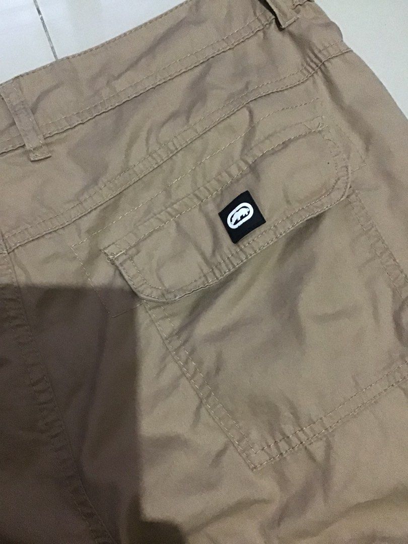 Ecko Unltd. Cargo Shorts Size 36 Tan (Category: Shorts) located in Manila. Submitted by sandobag (Listing ID 1457056503, Image 3). Description: - Cargo Shorts - W 36-38 L 25 - Excellent Condition - Color rate: 10/10 - Brand: Ecko Unltd. - Color: Tan - Size: 36 - Style: Classic Cargo Shorts - Features: Multiple pockets for ample storage - Closure: Button and zip fly - Ideal for: Casual wear, outdoor activities.