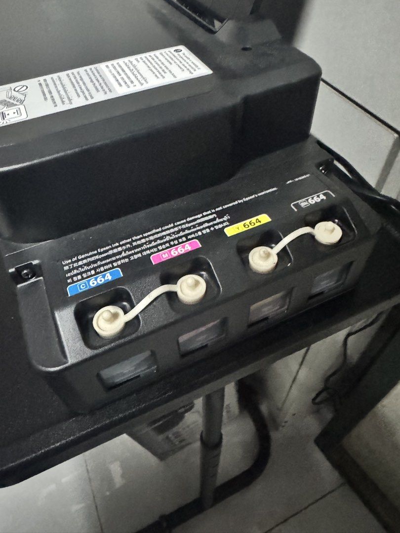 Epson Ecotank printer w/ ink cartridge (Category: Printers, Scanners & Copiers) located in Quezon City. Submitted by mateyyy_ (Listing ID 1457019633, Image 3). Description: Epson L121 Ecotank Printer w/ complete ink cartridge RFS: rarely used.
