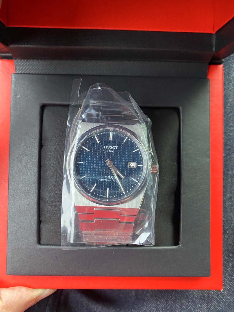 Essentially BN Tissot PRX (Category: Luxury Watches) located in Makati City. Submitted by jmz1077 (Listing ID 1457082720, Image 1). Description: For sale is this essentially brand new Tissot PRX Automatic blue dial 40mm. The watch is a corporate gift, box was just opened for the photos. Still in plastic. SRP is around 53k. .