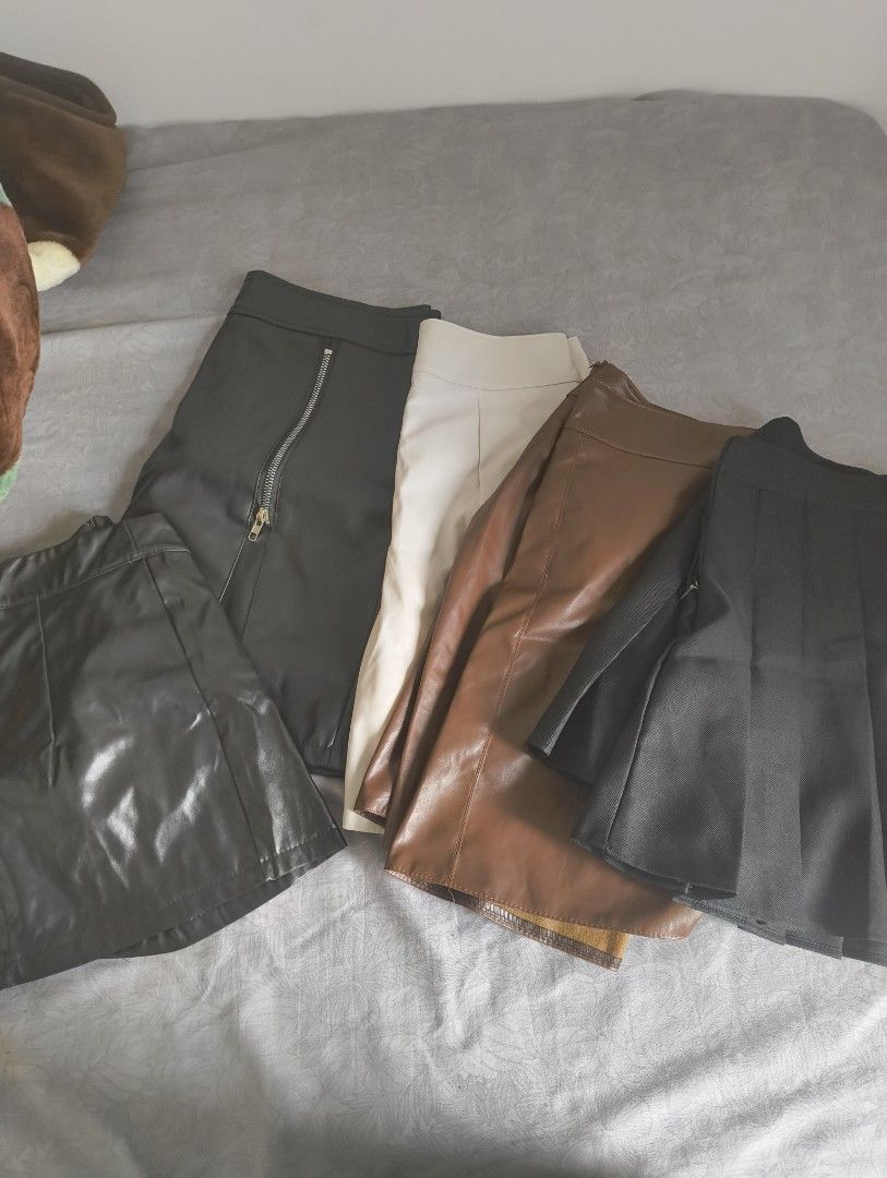 Faux Leather Skirts - Black, Brown, Cream (Category: Skirts) located in Makati City. Submitted by macegray (Listing ID 1457034721, Image 1). Description: - Bundle of 4 faux leather mini skirts - Includes: black pleated, black skirt with zipper and slit, brown A-line, cream A-line - All are mini length - Great for creating stylish outfits - Bundle deal!.
