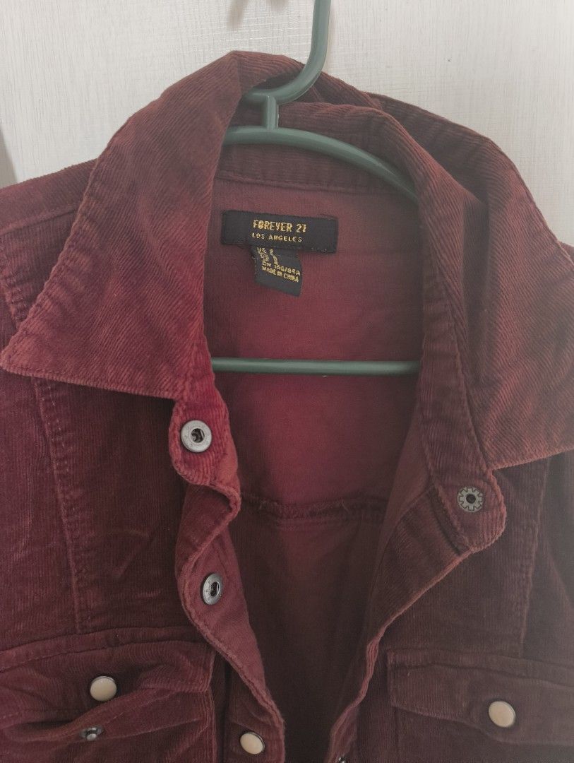 Forever 21 Corduroy Button-Up Shirt (Category: Shirts) located in Makati City. Submitted by macegray (Listing ID 1457034342, Image 3). Description: - Maroon corduroy shirt - Brand: Forever 21 - Long sleeves with button cuffs - Two chest pockets with button closures - Button-up front - Versatile: perfect for layering or wearing on its own.