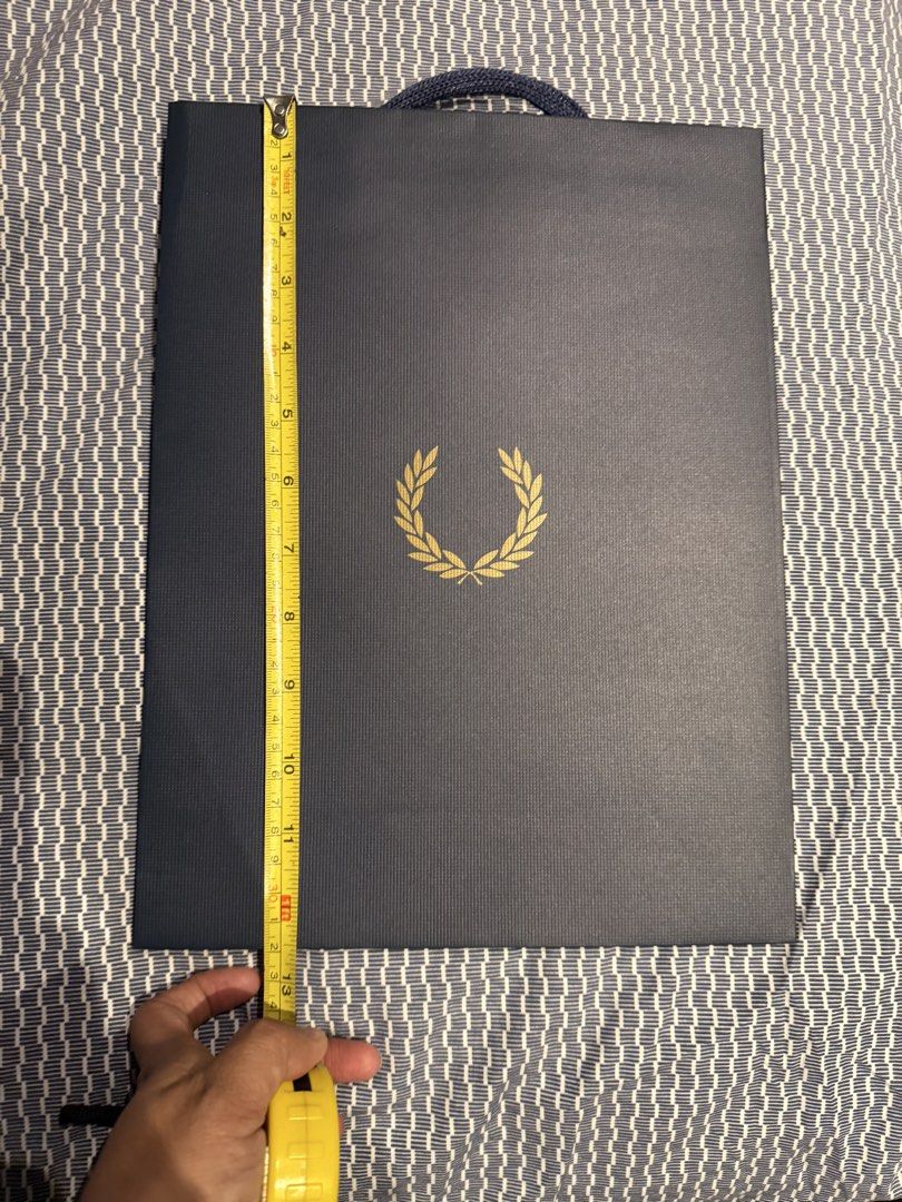 Fred Perry Paper Bag S (Category: Looking For) located in Valenzuela. Submitted by polchipreloveditems (Listing ID 1428210333, Image 3). Description: - Authentic Fred Perry Paper Bag (Size S) - Classic navy blue color - Features the iconic laurel wreath logo - available more than 2.