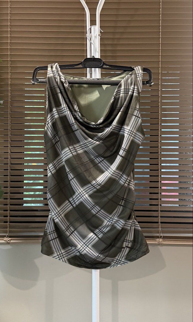 Green Plaid Cowl Neck Sleeveless Top (Category: Sleeveless) located in Caloocan City. Submitted by hellomaryon (Listing ID 1457015885, Image 1). Description: Olive green grid/plaid top with a trendy draped cowl neckline 🤎 Features a semi-sheer mesh overlay with a matching solid inner lining for comfortable coverage. Stylish and easy to dress up or down! ✨ Sleeveless cowl neck draped top ✨ Olive green, grey, and white plaid / grid print ✨ Lightwe