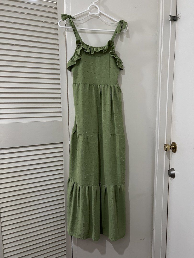 Green Ruffle Tie Strap Tiered Maxi Dress (Category: Dresses) located in Paranaque City. Submitted by arkingls (Listing ID 1456965284, Image 1). Description: - Cute green maxi dress - Ruffle trim along neckline - Tie straps - Subtle textured dot pattern fabric - Tiered skirt design - Ideal for casual outings or beach days - Comfortable and easy to wear.