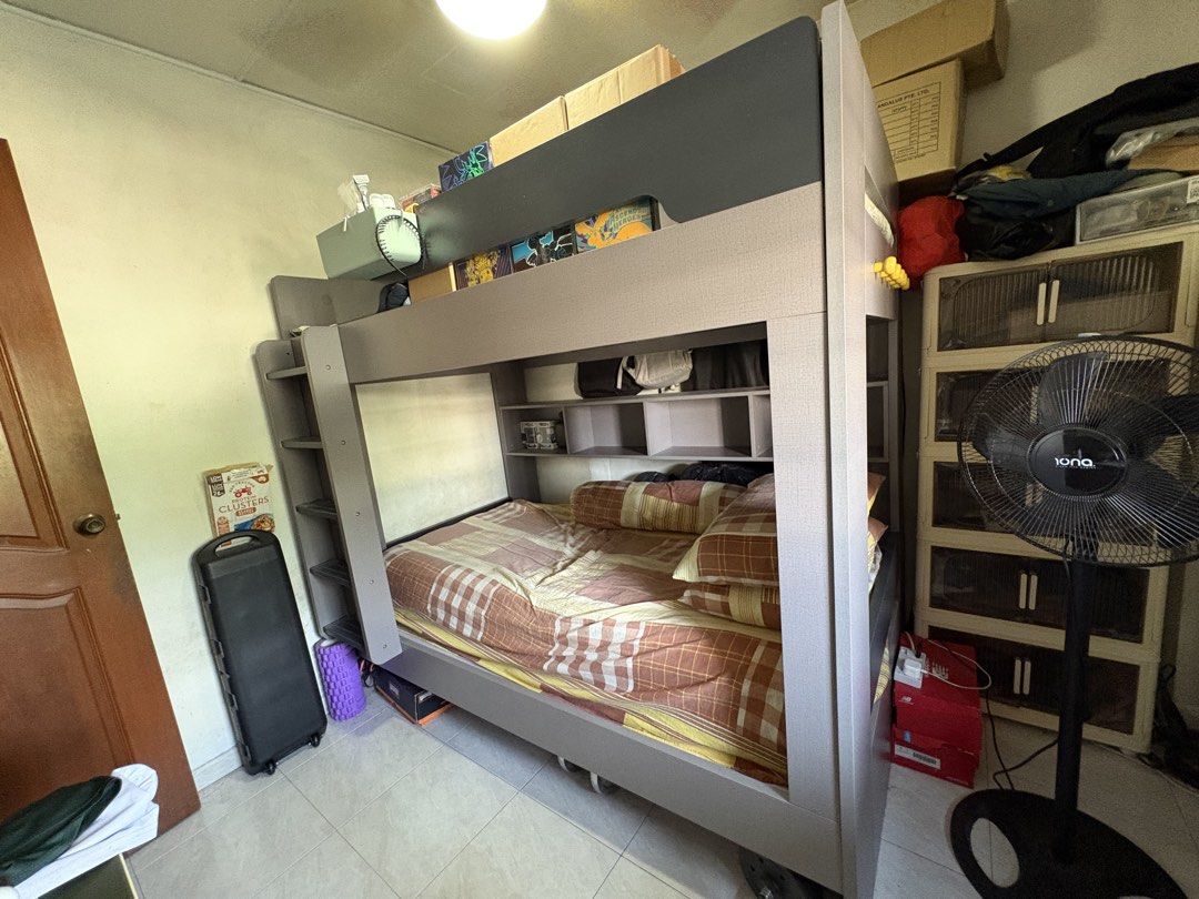 Bunk Bed Multi-Function Double Decker Bed Large Storage (Category: Bed Frames & Mattresses) located in Singapore. Submitted by nbk_10 (Listing ID 1457094329, Image 3). Description: - Sturdy grey bunk bed - Multi-function compartment storage bookshelf - Excellent space-saving solution - Dimensions: 196cm (L) x 180cm (H) - Top bunk width: 38cm - Width: 126cm - Arrange your own unassembled > delivery > assemble - Bed price is negotiable - 50% deposi