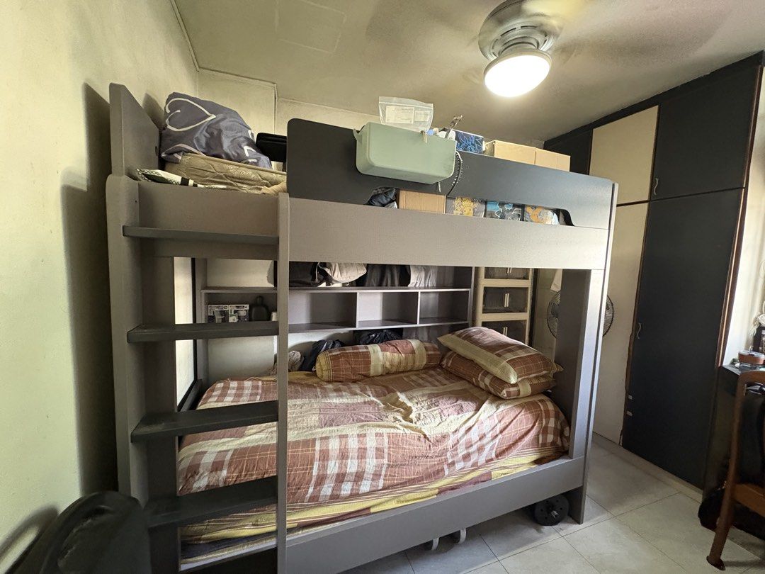 Bunk Bed Multi-Function Double Decker Bed Large Storage (Category: Bed Frames & Mattresses) located in Singapore. Submitted by nbk_10 (Listing ID 1457094329, Image 2). Description: - Sturdy grey bunk bed - Multi-function compartment storage bookshelf - Excellent space-saving solution - Dimensions: 196cm (L) x 180cm (H) - Top bunk width: 38cm - Width: 126cm - Arrange your own unassembled > delivery > assemble - Bed price is negotiable - 50% deposi