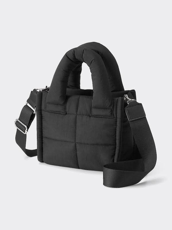 GU Black puff sling bag (Category: Tote Bags) located in Pasig City. Submitted by _secondchances (Listing ID 1457094866, Image 1). Description: - Stylish black puffer tote bag - Trendy quilted design all over - Comfortable puffy top handle - Includes a detachable shoulder strap for versatility - Ample interior space for all your essentials - Ideal for everyday use.