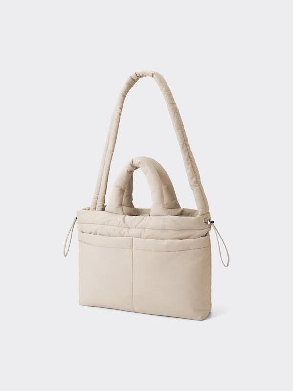 GU Puff Tote Bag - Beige (Category: Tote Bags) located in Pasig City. Submitted by _secondchances (Listing ID 1457094674, Image 1). Description: - Super cute padded tote bag - Neutral beige color - Two large outer pockets - Secure drawstring closure - Comfortable padded handles - Spacious for all your essentials - Ideal for everyday use or travel Used once only as a baby bag.