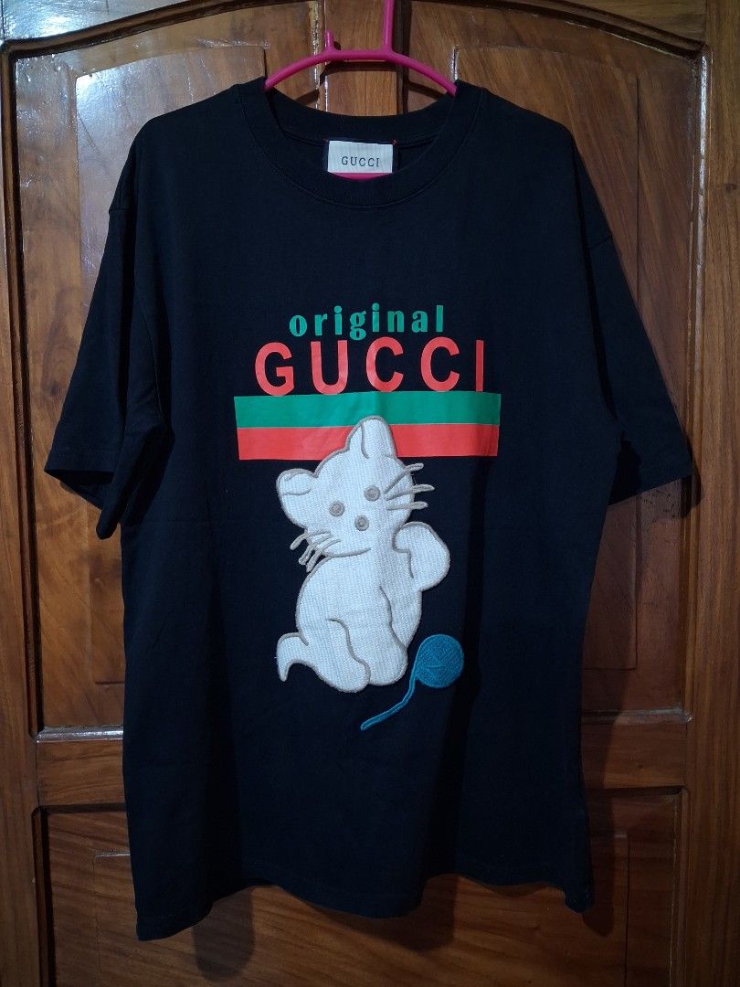 Gucci Black T-shirt (Category: Tshirts & Polo Shirts ) located in Prosperidad. Submitted by yangbai (Listing ID 1457104411, Image 1). Description: Gucci T-shirt color rate 10/10 dimes 21/27 excellent condition .