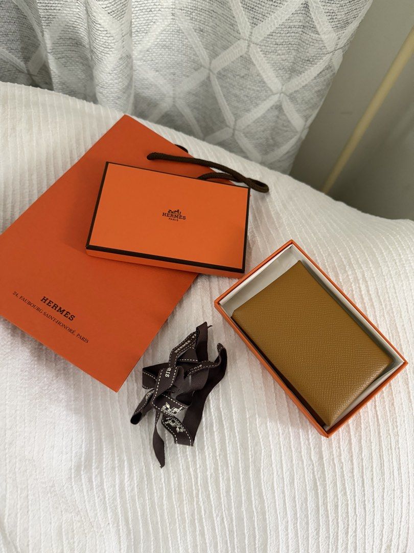 Hermes Calvi Duo Sesame (Category: Luxury Bags & Wallets) located in Las Pinas. Submitted by shopdeynuh (Listing ID 1456999262, Image 2). Description: Perfect for gifting. Like new, excellent condition, comes with box, ribbon, paperbag.