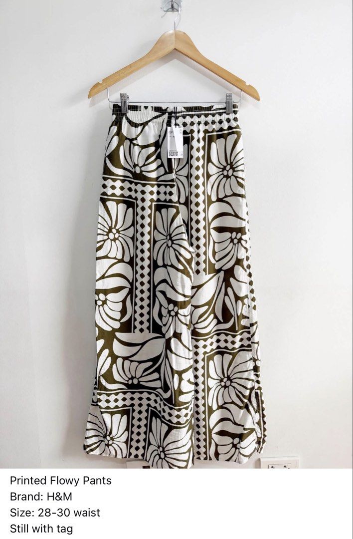 H&M Printed Flowy Pants - Size 28-30 Waist (Category: Other Bottoms) located in Paranaque City. Submitted by closetcoph (Listing ID 1457048367, Image 1). Description: - Flowy pants from H&M - Cool olive green and white print - Comfortable elastic waistband - Size 28-30 waist - Brand new with original tag attached - Perfect for a casual, breezy look -Retail 1490.