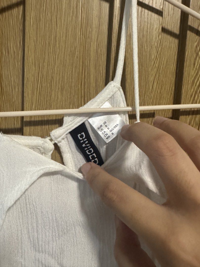 H&M White Long Halter Top (Category: Sleeveless) located in Paranaque City. Submitted by prelovedbye__ (Listing ID 1457085690, Image 3). Description: With small stain (seen on pic).