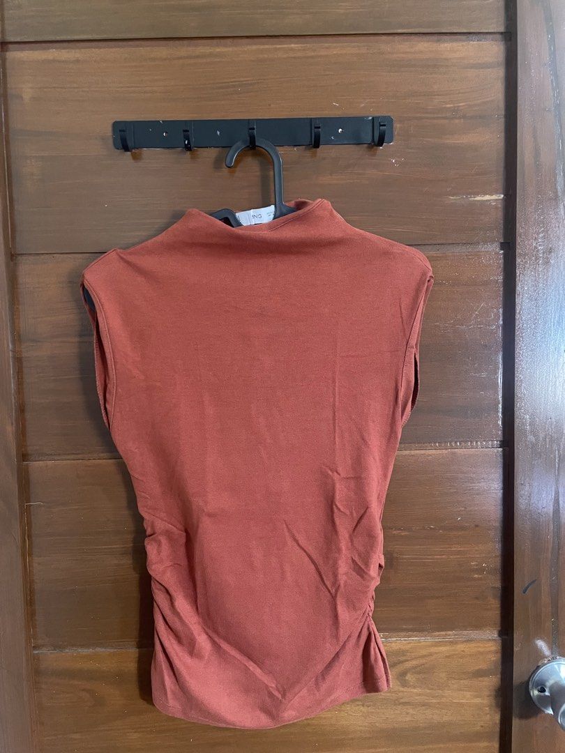 INGNI Sleeveless Mock Neck Ruched Top (Category: Sleeveless) located in Caloocan City. Submitted by theresedolor (Listing ID 1457050264, Image 2). Description: - Cute sleeveless top from INGNI - Features a mock neck and side ruching - Lovely rust/burnt orange color - Versatile: dress up or down, layer, or wear on its own - Comfortable fabric.