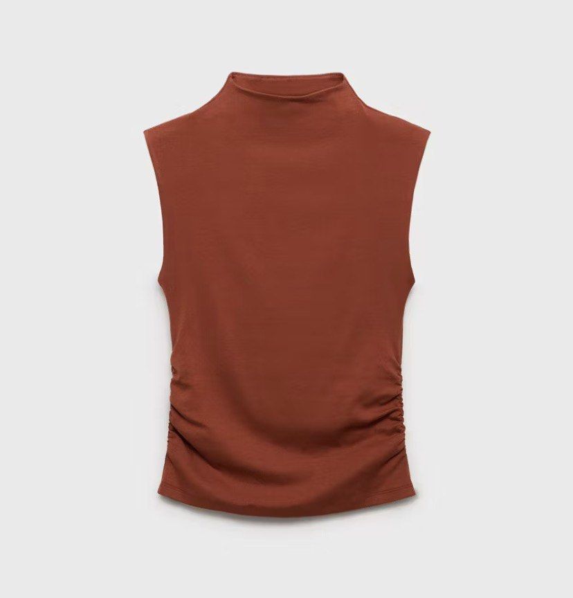 INGNI Sleeveless Mock Neck Ruched Top (Category: Sleeveless) located in Caloocan City. Submitted by theresedolor (Listing ID 1457050264, Image 1). Description: - Cute sleeveless top from INGNI - Features a mock neck and side ruching - Lovely rust/burnt orange color - Versatile: dress up or down, layer, or wear on its own - Comfortable fabric.