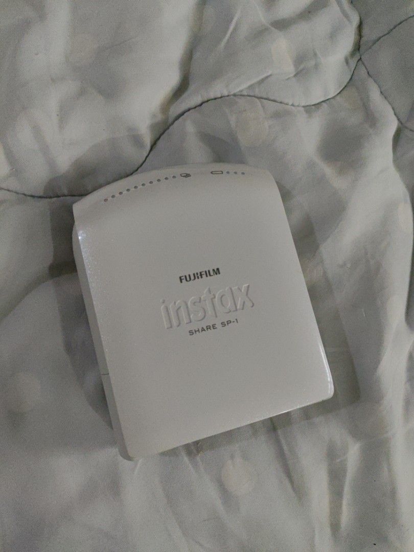 INSTAX SP-1 Share Instax printer (Category: Cameras) located in Mandaue City. Submitted by regdeclutters (Listing ID 1457050130, Image 1). Description: Printer Only (no charging cable) Still works but I don't have the cable or film - Fujifilm Instax SP-1 Share printer - Color: White - Connects wirelessly to smartphones for instant photo printing - Compact and portable design - Easy to use.