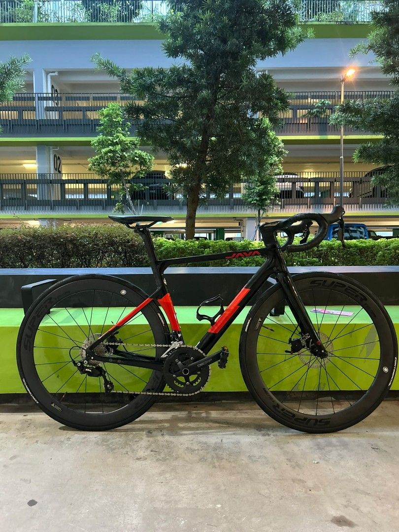 Java vesuvio fb (Category: Bicycles) located in Singapore. Submitted by seller1973 (Listing ID 1457008181, Image 1). Description: java vesuvio . entire frame is carbon fork is carbon too black red colourway shimano 105 groupset decaf crankset shimano 105 shifters Superteam classic d28-50 ws GP5k tyres with tpu innertube decaf mechanical disc brakes decaf integrated handlebar decaf saddle bottle cages included ( decathalon and lezene ) also CHAIN 