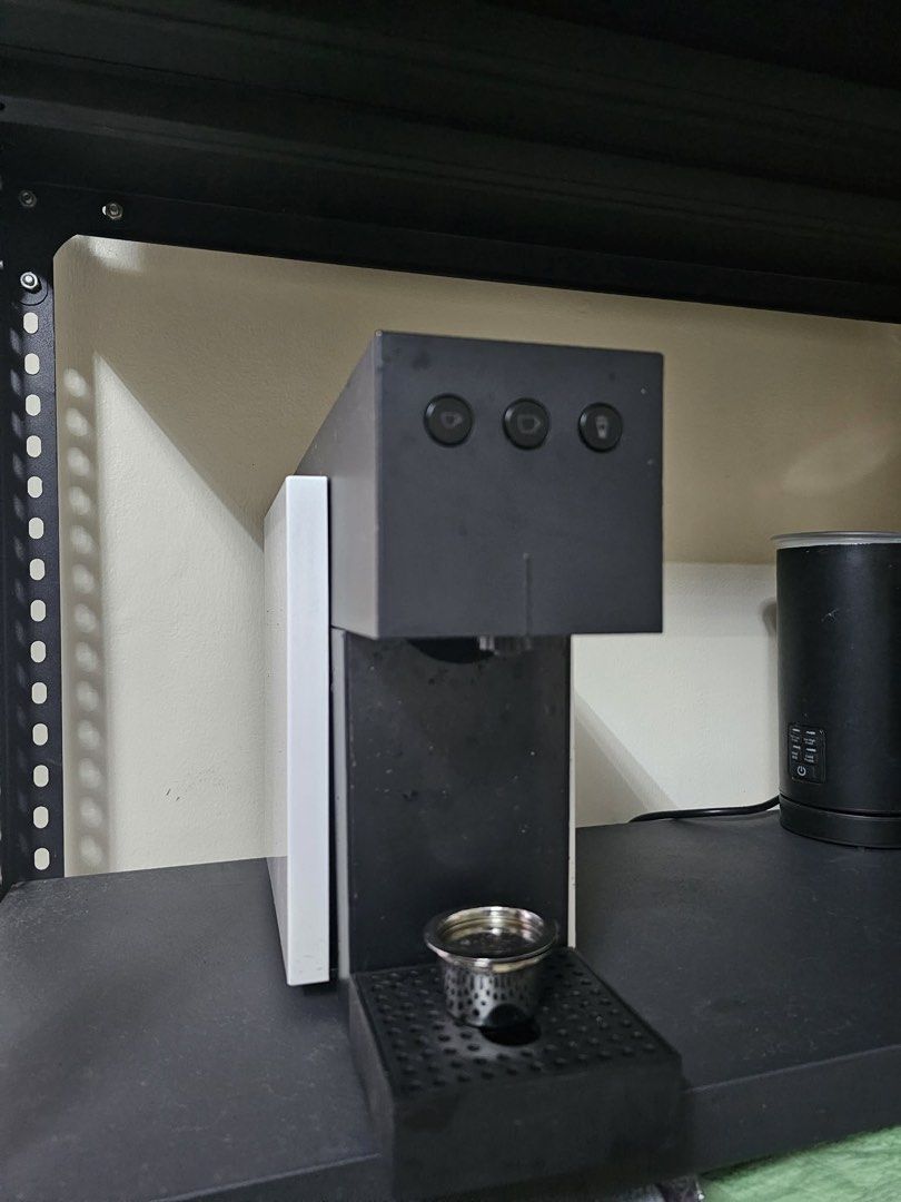 K-Fee Expressi Coffee Machine + FREE Stainless Reusable Capsule (w/ Box) (Category: Coffee Machines & Makers) located in Manila. Submitted by joeygracemej (Listing ID 1457123331, Image 2). Description: Selling a preloved K-Fee Expressi Capsule Machine in good working condition. Sleek black and white design that looks great on any countertop! Inclusions: K-Fee Expressi Capsule Machine (Black/White) Original box, inner packaging, and quick start gu