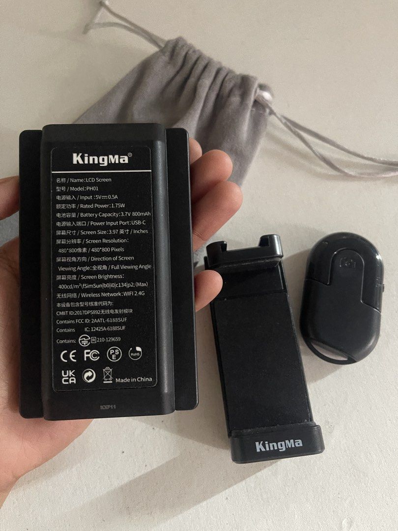 KingMa PH01 LCD Screen Vlogging Kit with Remote (Category: Video Cameras) located in Malabon City. Submitted by cosmicowl.309855 (Listing ID 1457002009, Image 2). Description: - KingMa PH01 LCD Screen for Vlogging - Includes Phone Holder & Wireless Remote - Screen Resolution: 480*800 pixels - Battery: 3.7V 1800mAh - Charging: USB-C - Features Standard Tripod Mount - Comes with Grey Drawstring Pouch.