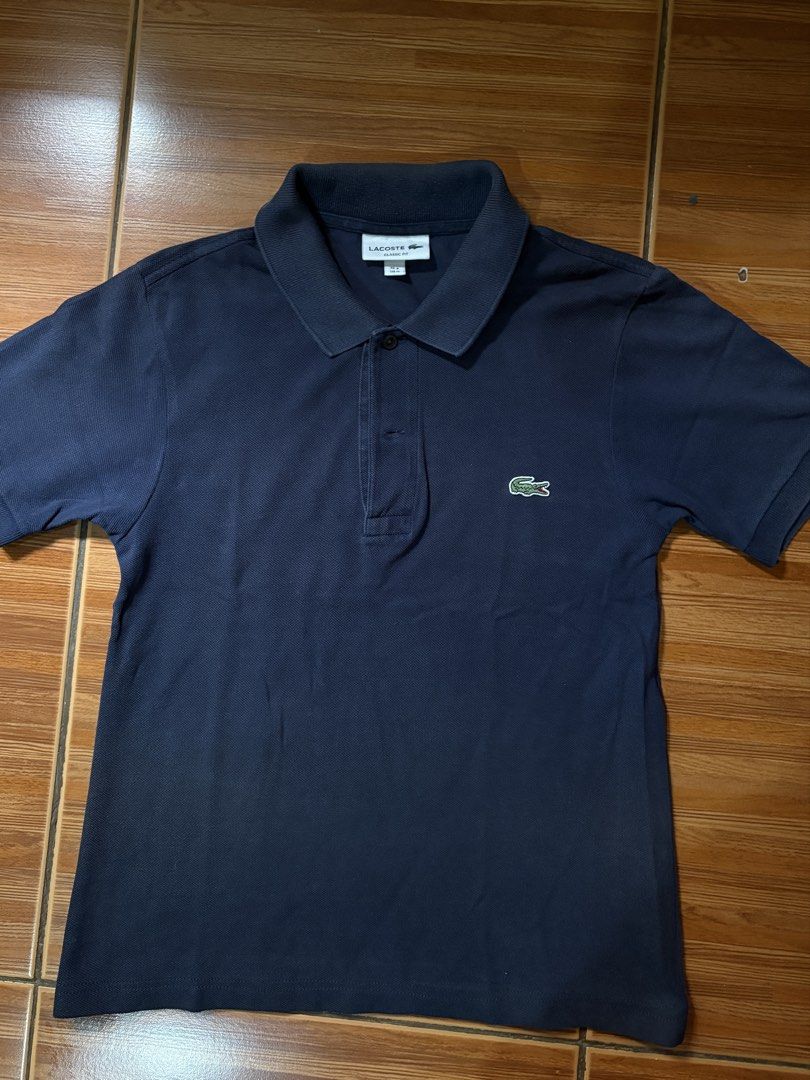 Lacoste Navy Blue Polo Shirt (Category: Shirts) located in Paranaque City. Submitted by jsczz (Listing ID 1456990335, Image 1). Description: No issues 8.5/10 color rate 17x23 dimes Good for womens s-m Authentic.