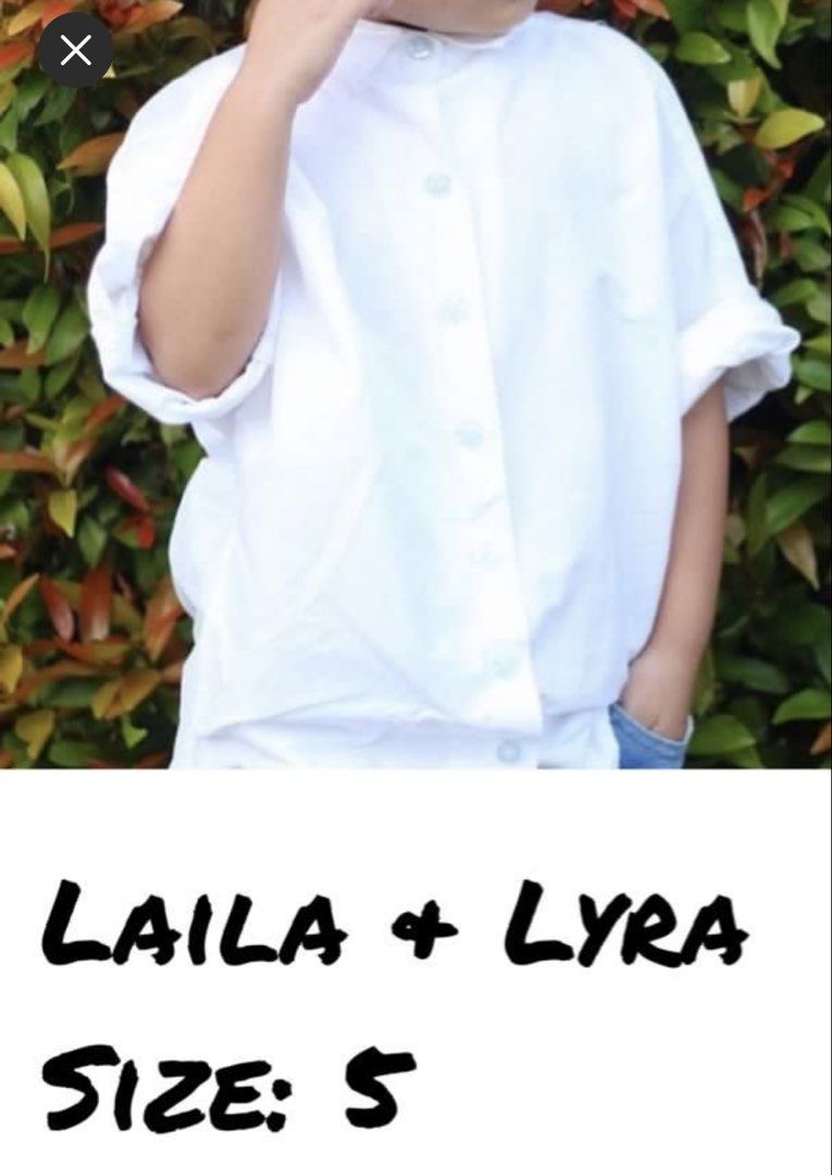 LAILA + LYRA White Button-Up Shirt Size S (Category: Babies & Kids Fashion) located in Makati City. Submitted by team_maxvin (Listing ID 1456983649, Image 1). Description: - Brand: LAILA + LYRA - Style: White short-sleeved button-up shirt - Collar: Mandarin collar - Size: S - Condition: Good - Versatile: Great for casual wear or dressing up, pairs easily with jeans or shorts..