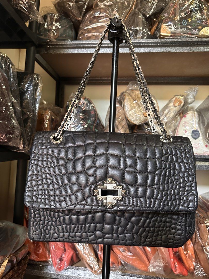 Lanvin Embossed Leather Bag (Category: Luxury Bags & Wallets) located in Butuan. Submitted by slownsteady_ (Listing ID 1457062056, Image 2). Description: - Vintage Lanvin stylish black bag - Durable leather material - Spacious interior - Classic and versatile design.